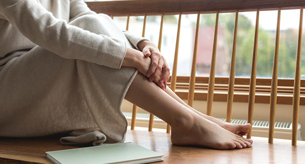 blog woman-resting-her-feet-by-the-window