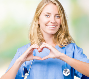 female nurse giving heart symbol with hands