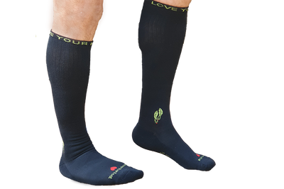 Charcoal bamboo compression socks on trans background legs