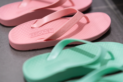 Archline Flip Flop thongs, pink and green, a pair of each side by side