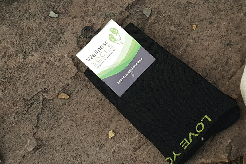 Charcoal bamboo compression socks - label on rock